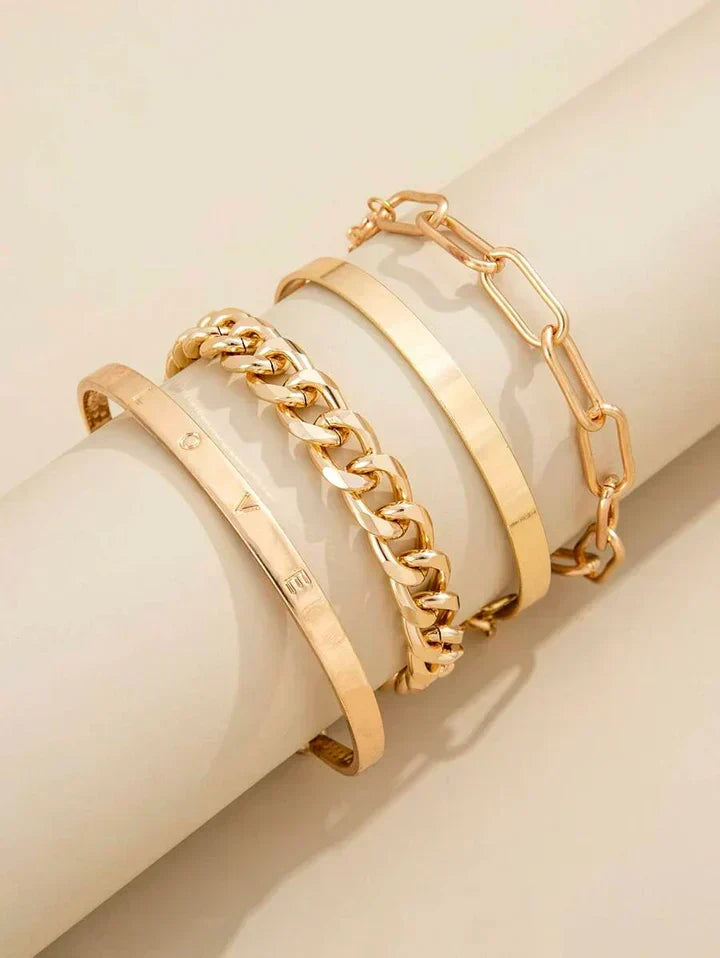 Juego de pulseras doradas modernas